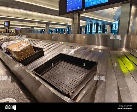 Baggage reclaim area at Hamad International Airport showing oversized luggage handling belts