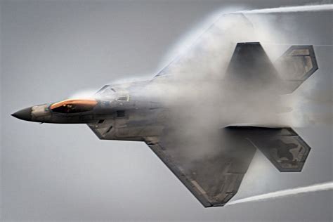 BD-5J microjet in flight during airshow with visible afterburner trail and high bank angle