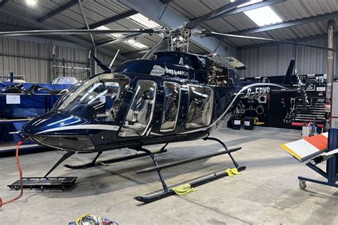 Bell technician performing maintenance on a Bell 407 GXi rotor system in Montreal, 2024