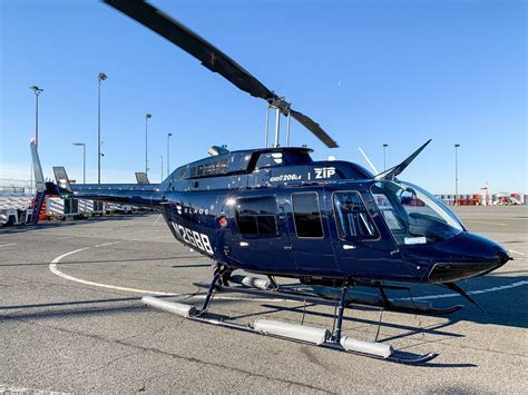 blade helicopter in flight with sunset over new jersey skyline