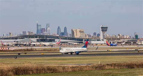 blind traveler receiving assistance inside Philadelphia International Airport terminal
