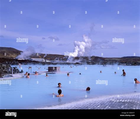 Blue Lagoon geothermal spa near Reykjavik with steam rising and tourists relaxing