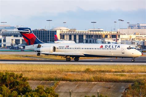 Boeing 717 Delta Air Lines narrowbody aircraft parked at airport terminal