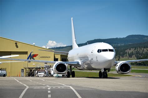 Boeing 737-400SF cargo aircraft parked on airport freight ramp