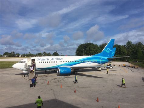 Boeing 737-700 passenger jet of Nauru Airlines in post-2014 livery parked at Nauru International Airport