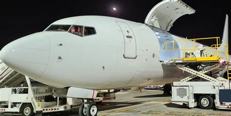 Boeing 737-700 passenger to freighter cargo conversion aircraft on apron