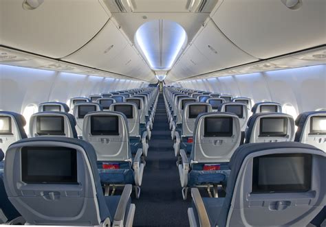 Boeing 737-900ER cabin interior high density seating configuration with exit doors