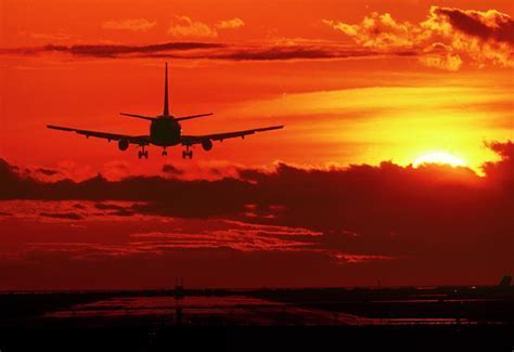 Boeing 737 landing under sunset skies at regional airport