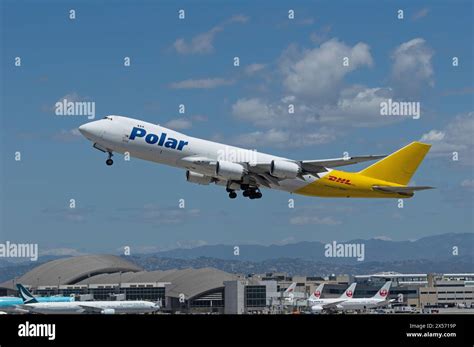 Boeing 747-8 freighter aircraft taking off from international airport runway