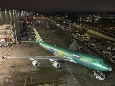 Boeing 747-8 parked during golden hour highlighting iconic upper deck