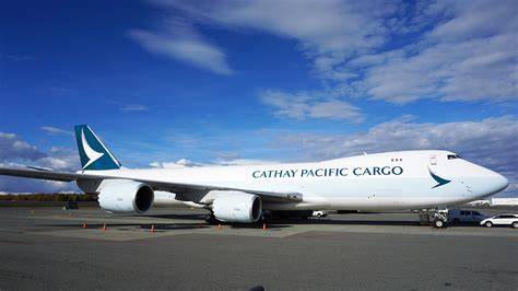 Boeing 747-8F cargo aircraft flying over global freight network