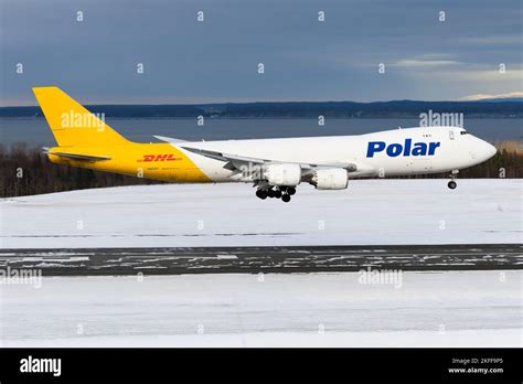 Boeing 747-8F freighter crossing polar route above Arctic clouds