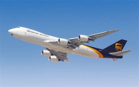 Boeing 747-8F in flight cargo global logistics sunset
