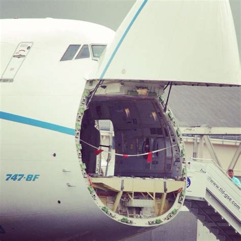 Boeing 747-8F nose cargo door open during freighter loading operation