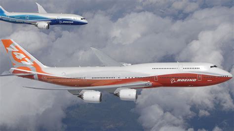 boeing 747-8i flying at cruising altitude over pacific ocean with sunset light