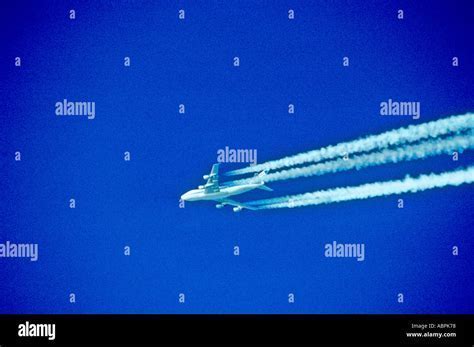 Boeing 747 cruising above Atlantic Ocean at dusk