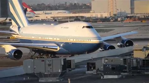 Boeing 747SP taxiing at sunset with four engines visible under wide wings