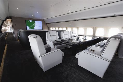 Boeing 767 jet with luxury dining room and gold detailing
