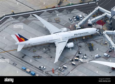 Boeing 777-300ER aircraft parked at international airport terminal
