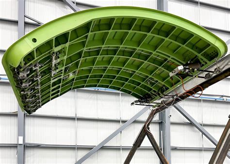 Boeing 777 fuselage cargo door installation during freighter conversion