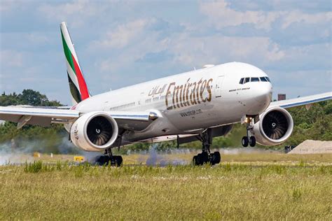 Boeing 777 landing at major international airport at dusk