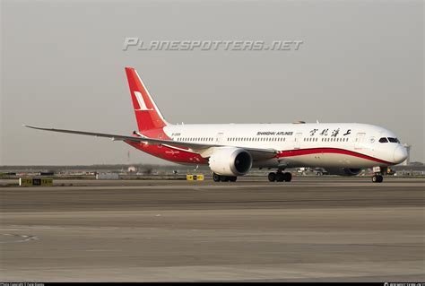 boeing 777 parked next to boeing 787 at shanghai pudong airport