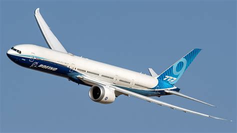 Boeing 777X flying above clouds on ultra long haul route concept