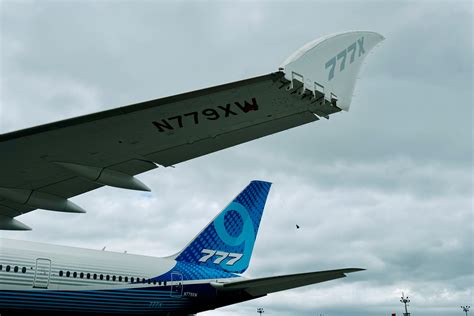 Boeing 777X folding wingtips test flight dramatic sky