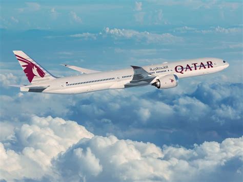 Boeing 777X in Qatar Airways livery at airshow unveiling ceremony