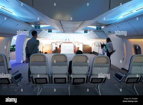 boeing 777x wide cabin interior showing overhead bin and dimmable window features