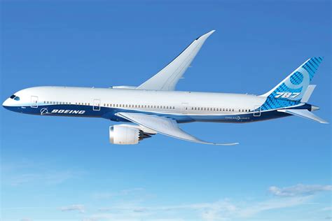 Boeing 787-9 Dreamliner widebody aircraft banking above cloud layer