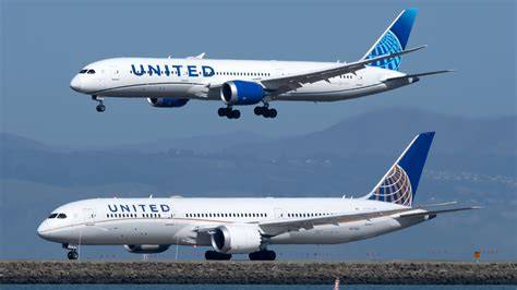 Boeing 787 Dreamliner and 777-200ER parked on airport apron