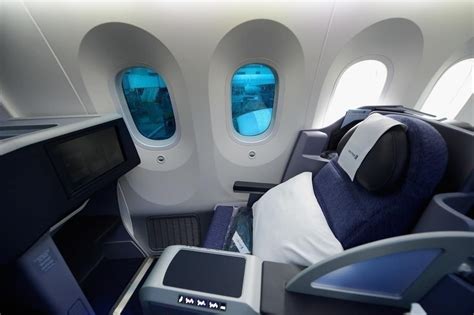 Boeing 787 Dreamliner passenger cabin large dimmable windows and modern interior