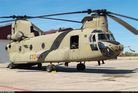 Boeing CH-47 Chinook lifting oversized cargo in a desert environment
