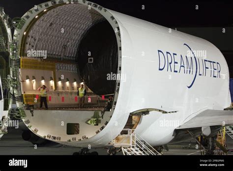 Boeing Dreamlifter loading 787 fuselage barrels through hinged tail