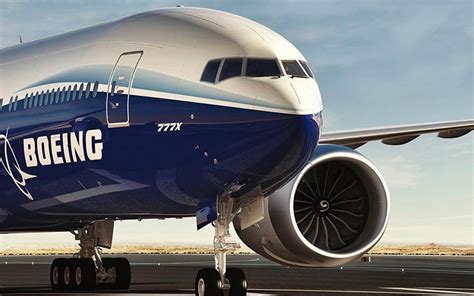 Boeing engineers inspecting GE9X-powered 777X during certification program