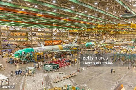 Boeing Everett factory final assembly line with quality inspection teams