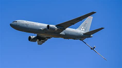 boeing kc-46 undergoing flight certification at dusk