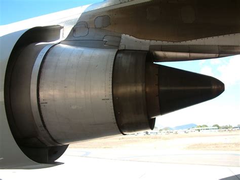 Boeing MD-11 engine pylon maintenance inside cargo aircraft hangar