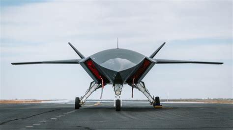 Boeing MQ-28 Ghost Bat drone flying alongside fighter jet