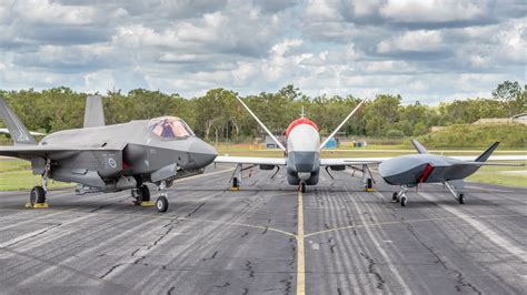 Boeing MQ-28 Ghost Bat flying alongside F-35 fighter aircraft
