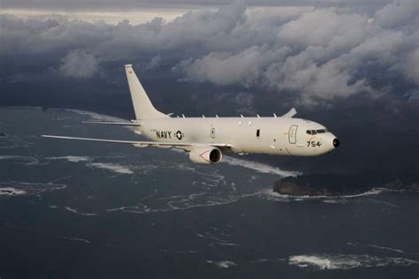 Boeing P-8A Poseidon maritime patrol aircraft flying over ocean