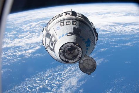Boeing Starliner spacecraft docking with space station