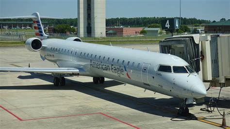Bombardier CRJ900 with rear-mounted turbofan engines at gate