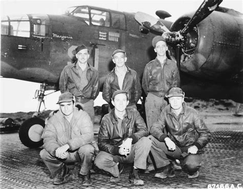 Bomber Crew characters managing stations inside a WWII bomber during a chaotic mission
