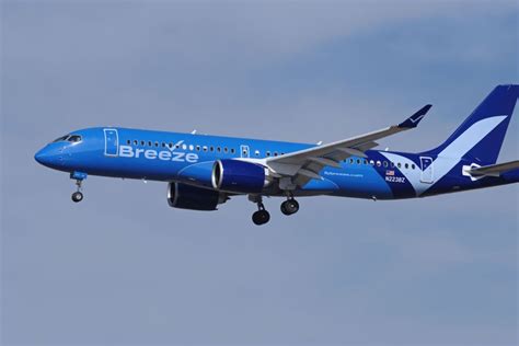 breeze airways fleet including airbus a220 and embraer aircraft on apron