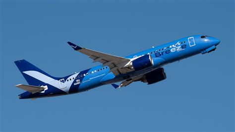 Breeze Airways international route expansion from Tampa Airport departure board