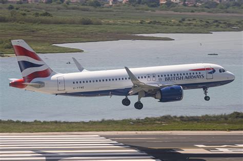 British Airways Airbus A320neo departing London Heathrow during sunset climb