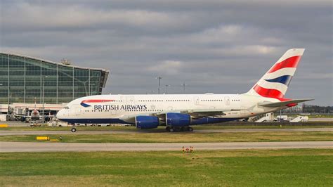 british airways airbus a380 taxiing at heathrow airport in foggy weather