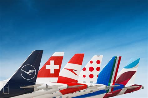 british airways and qatar airways tail fins at international gate